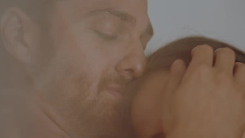 Closeup of a couples face embracing each other lovingly