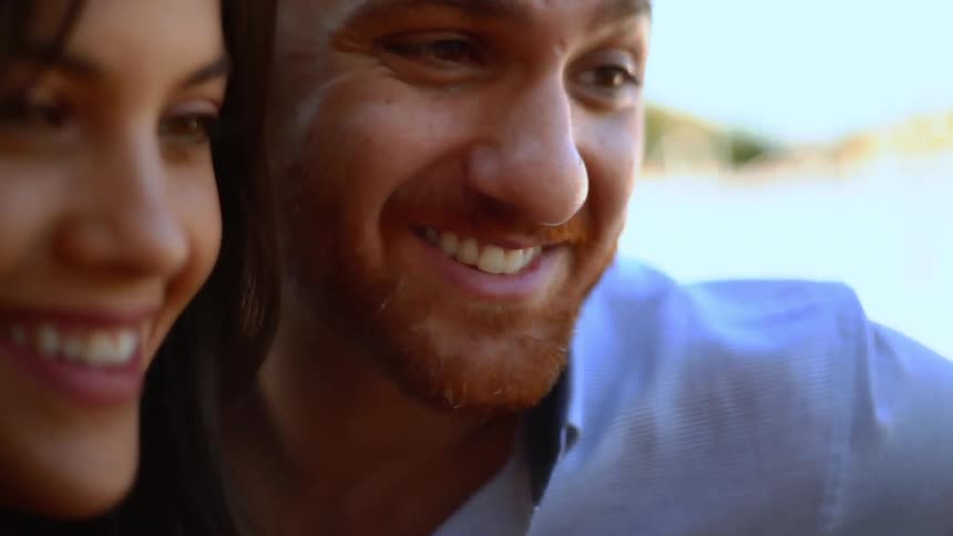 Portrait of a man and a woman side by side smiling