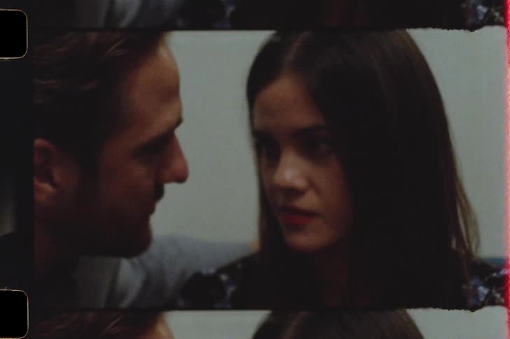 A man and woman are kissing