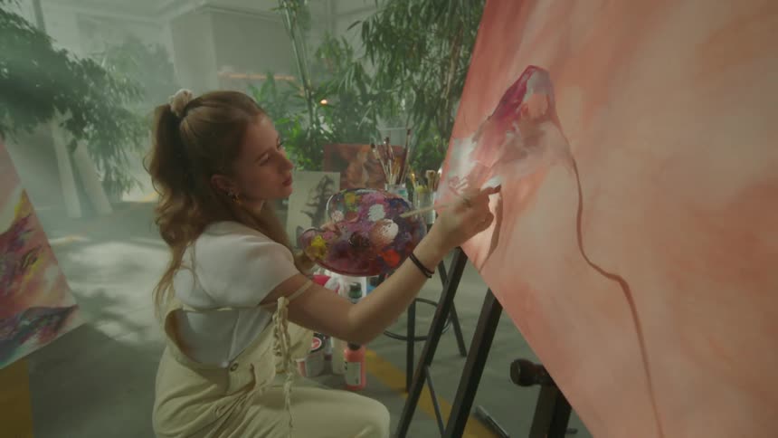 Artist painting on canvas
