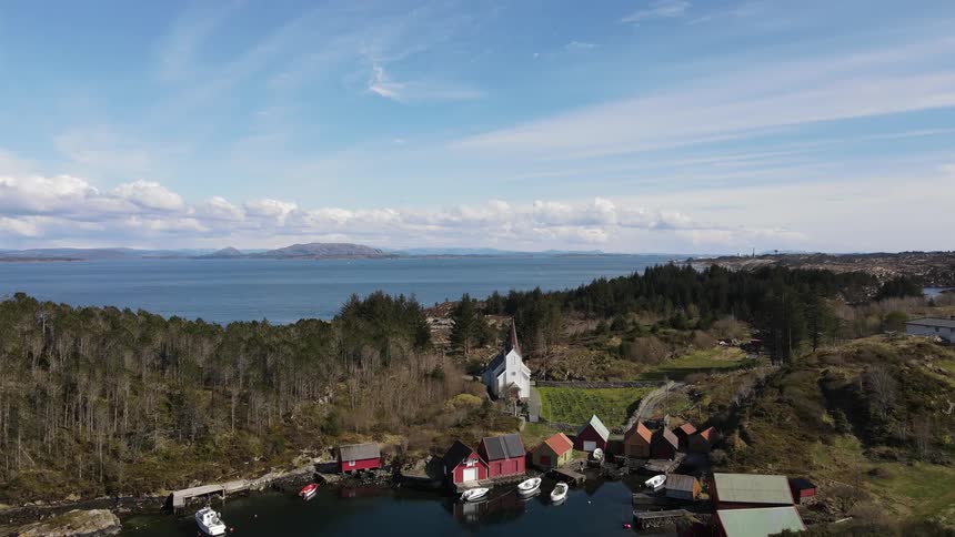 Aerial view of a church in a coastal town in a lake