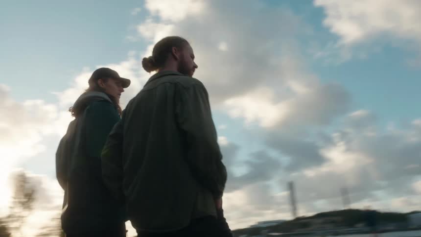 Two men standing outside talking