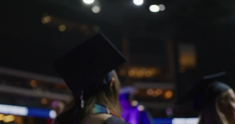 Group of people in a hall on a graduation uniform