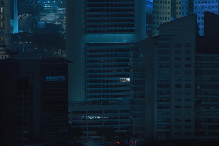 The lights flash and then turn off in the buildings