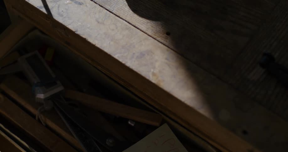 A person opens and closes a drawer