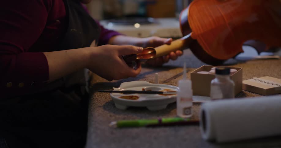 A person working on a guitar