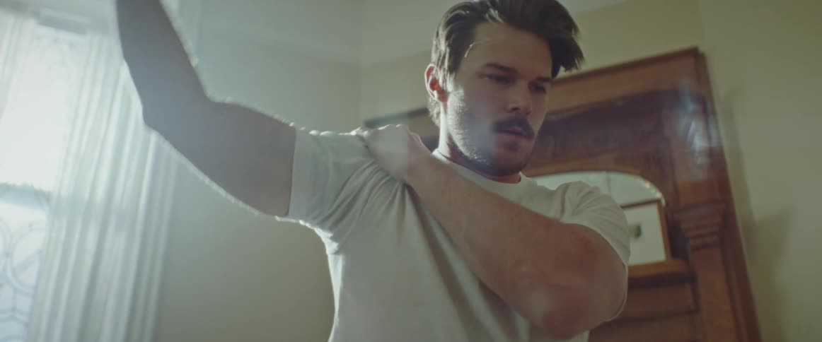A man stretching at home