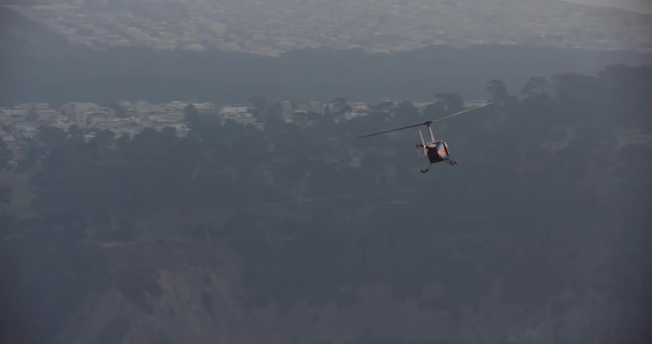 Aerial of a helicopter flying over the San Francisco Bay