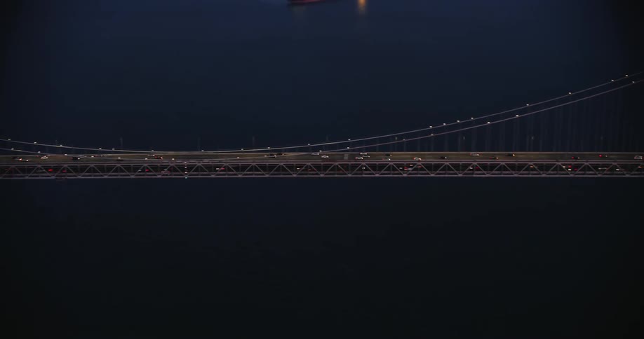 The busy Bay Bridge leading into San Francisco at night