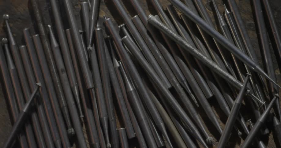 Several pieces roll in a pile of tools