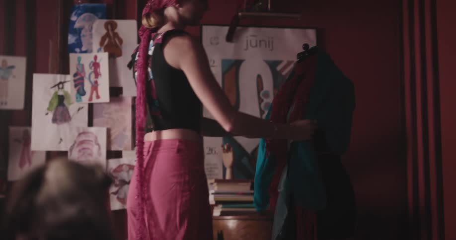 Two tailors are working on dresses