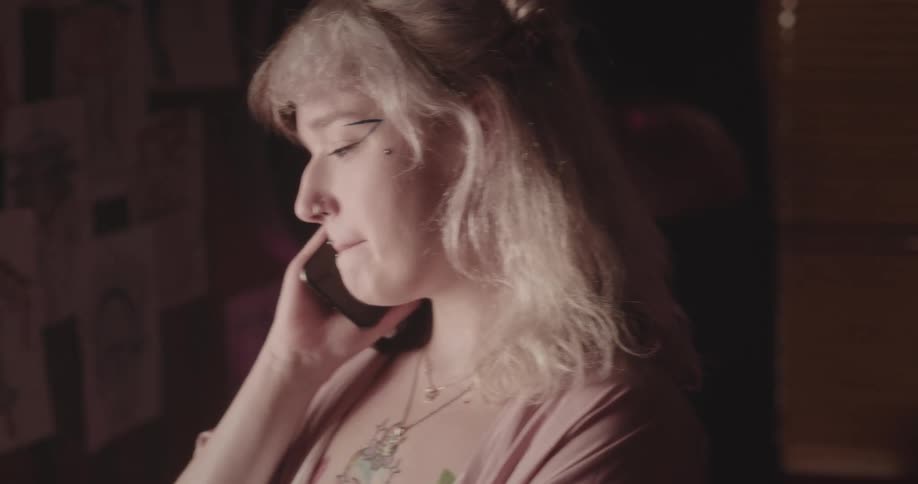Portrait of a young woman talking on the phone