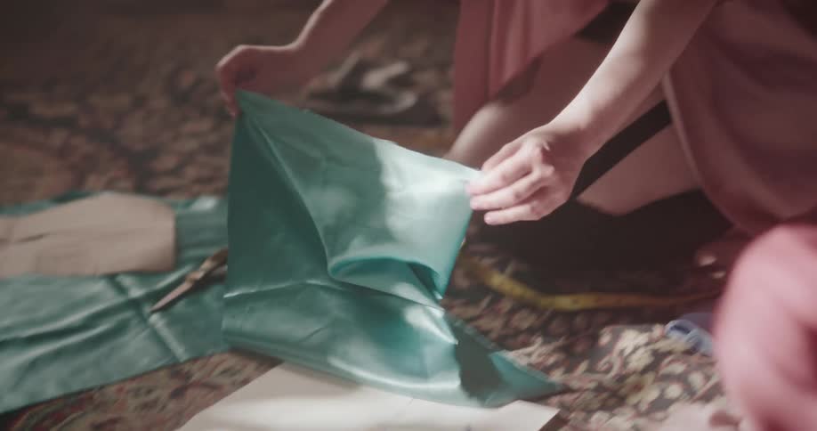 A tailor cutting a dress