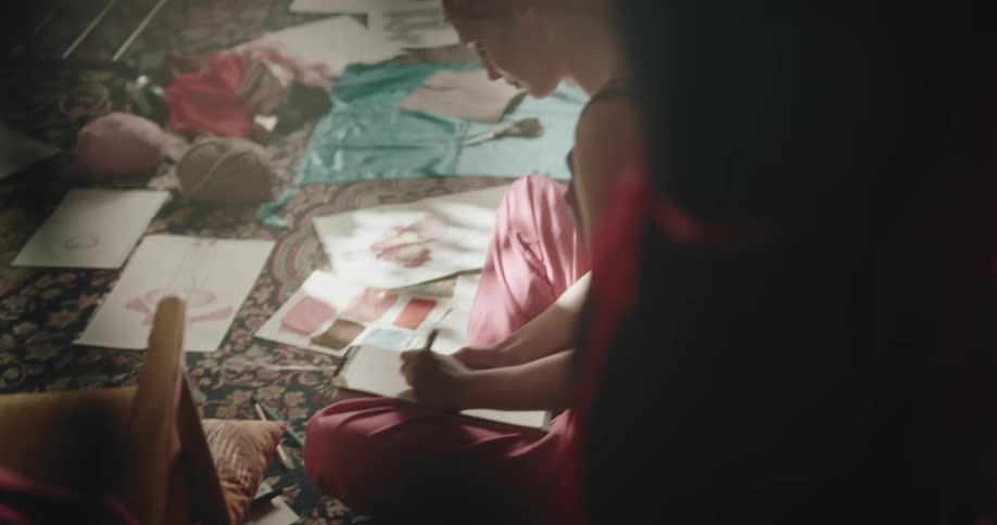 Friends create clothing items in a drawing