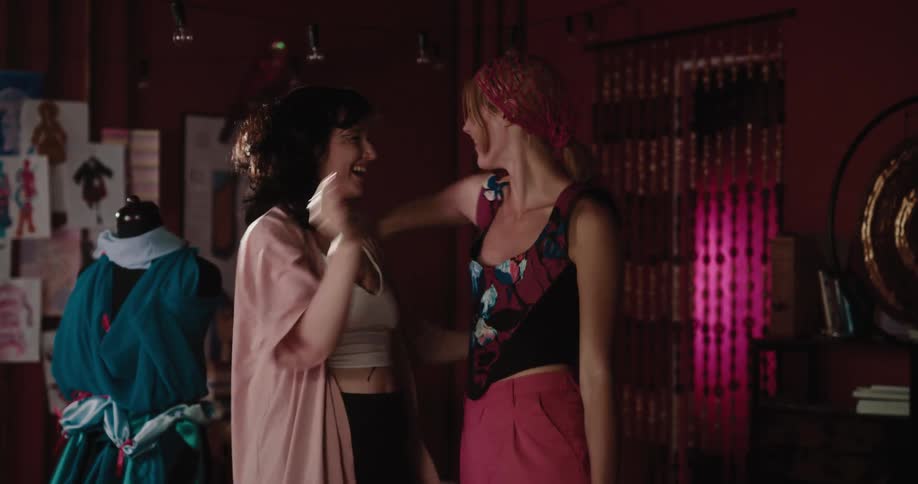 Two friends greeting each other with smiles