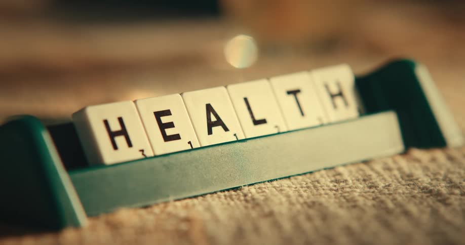 Scrabble tiles placed in holder spell health
