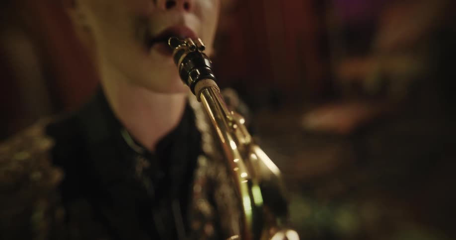 A clip of a lady playing a trumpet