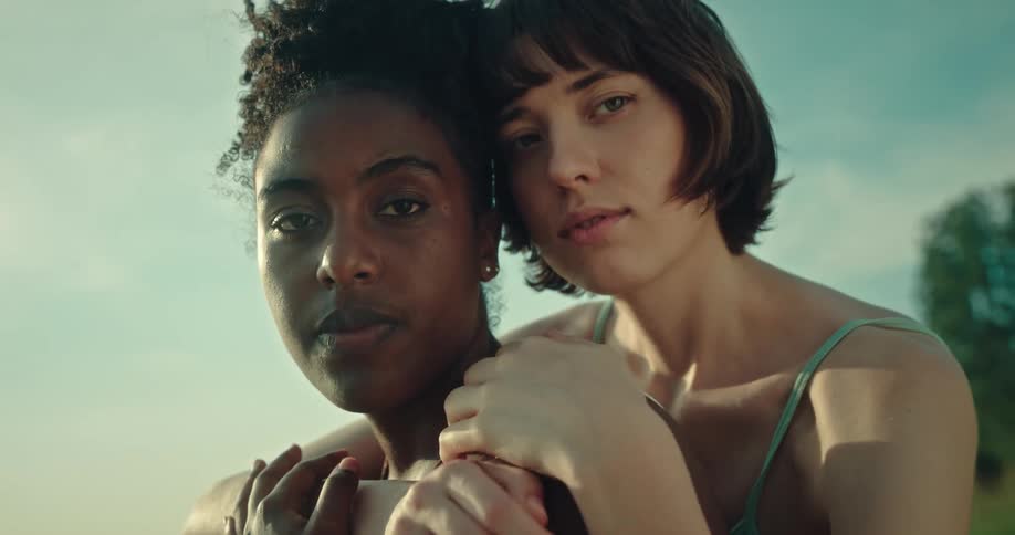 Two women are hugging each other