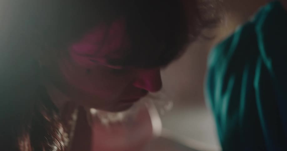 A clip of a tailor dressing a mannequin