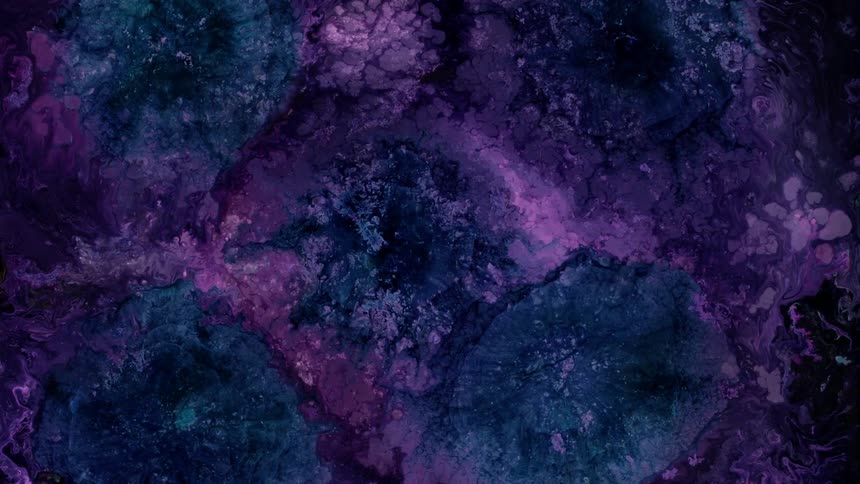 A liquid opening up like a flower in purple blue and pink color