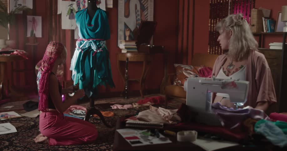 Two women are working on making dresses