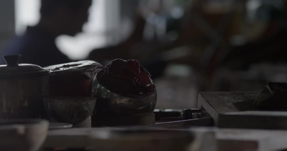 A jewelry maker works on jewelry