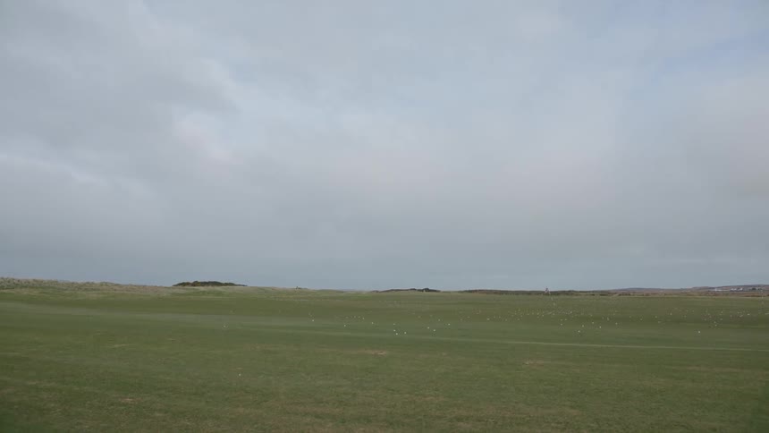 Green grass driving range on a field at daytime
