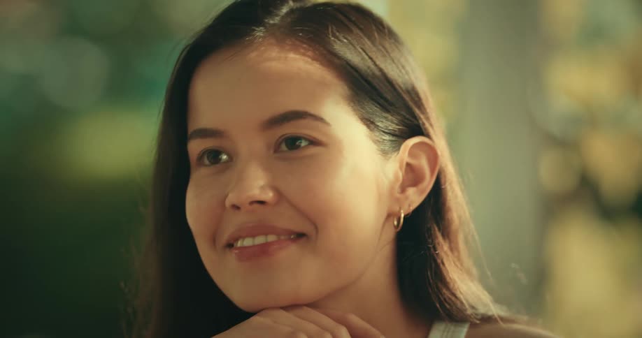 Face of a young woman listening to a friend