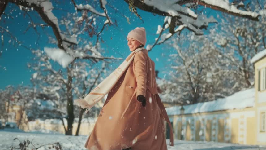 A lady playing in the snow