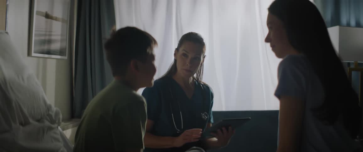 A young patient talking to his doctor in the hospital