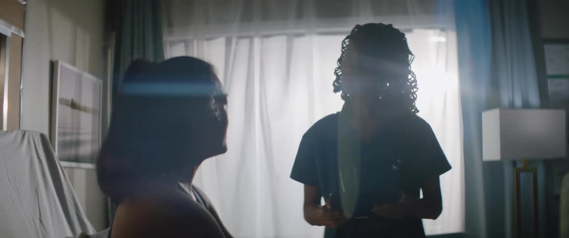 Nurse talking to a patient inside a room