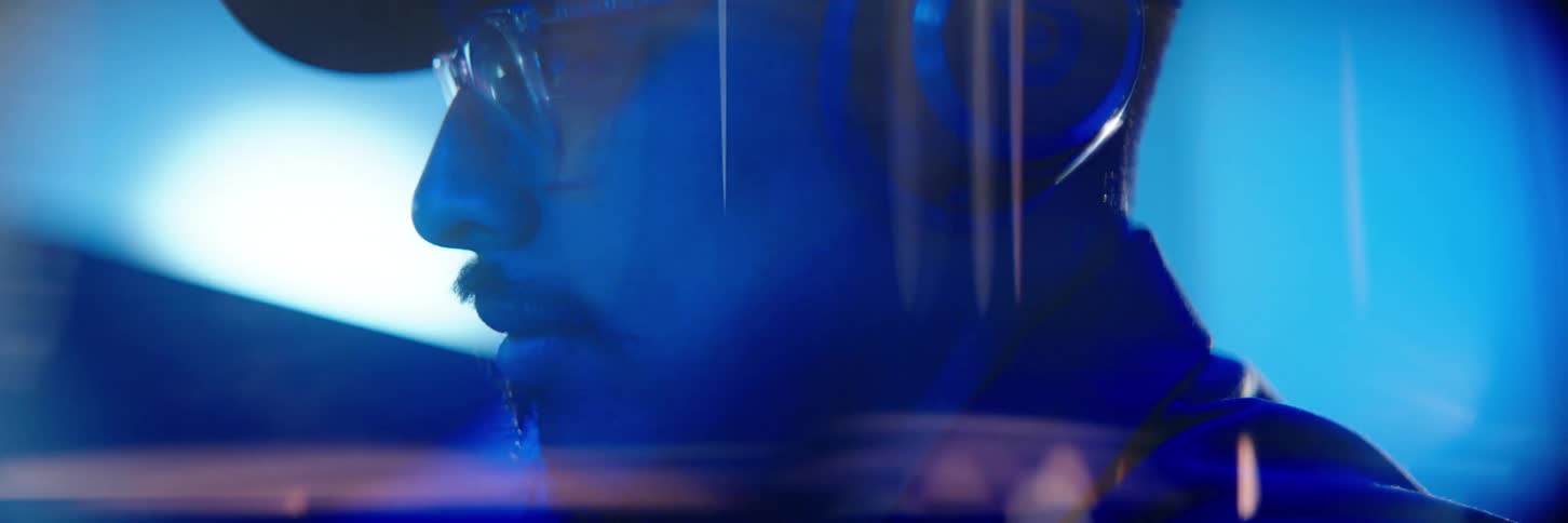 Closeup of a mans face with a headset in his ear