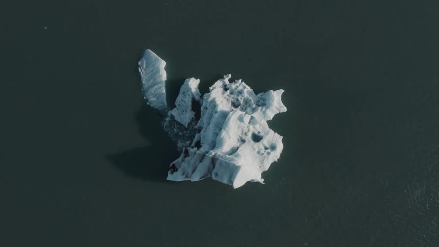 Aerial panorama of an iceberg in the middle of the sea