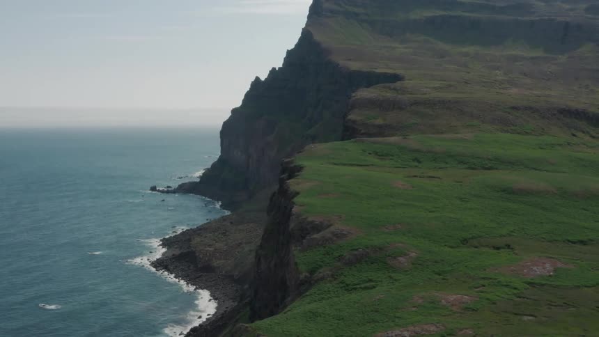 Aerial panorama of the coastal shoreline against a blue sky