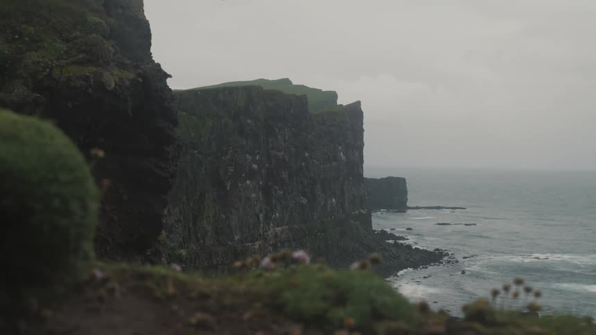 A cliff on the shore of a beach