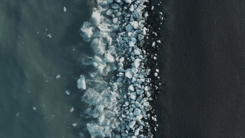 The shore is lined with ice
