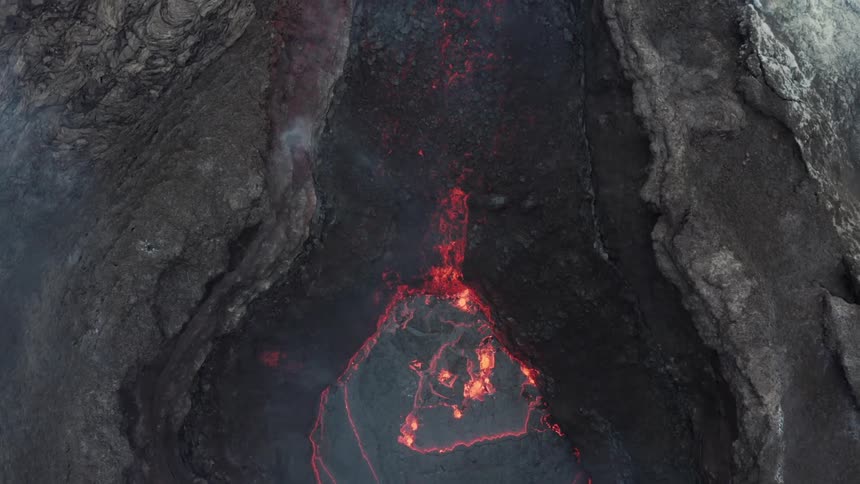Aerial panorama of a volcano crater with lava