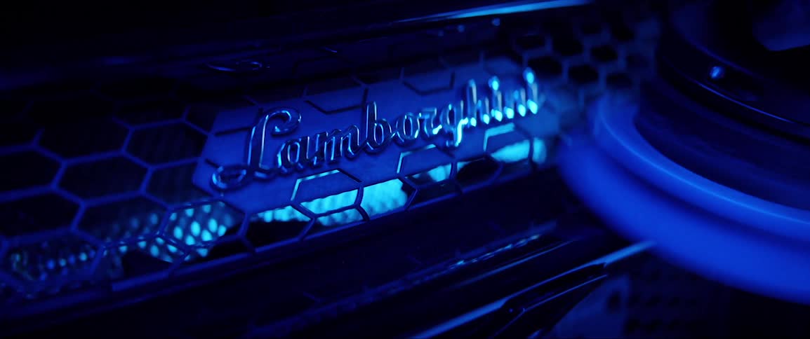 A power tool polishing a brand logo