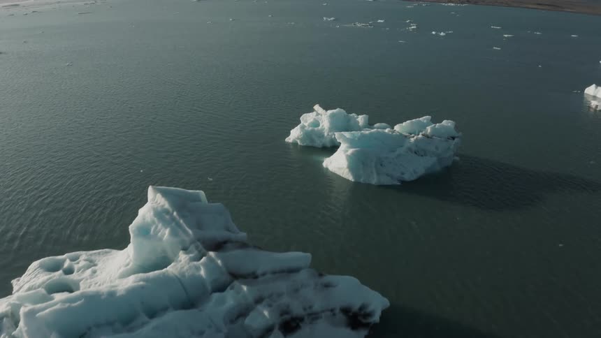 Aerial panorama of the sea with small icebergs