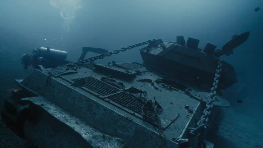 A diver is exploring a shipwreck