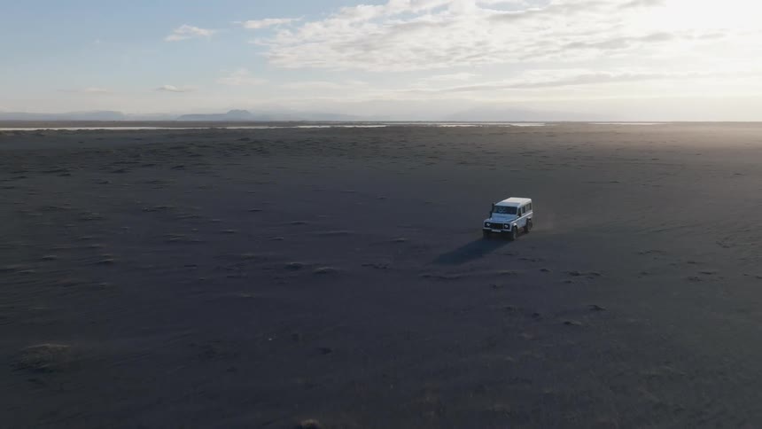 A truck is driving off road down the landscape