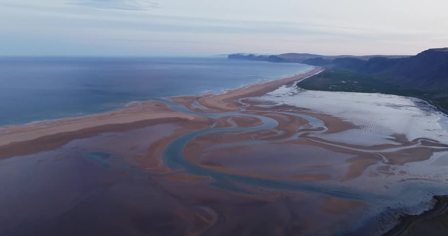 Aerial panorama of the sea coastline and sand islands beneath the water