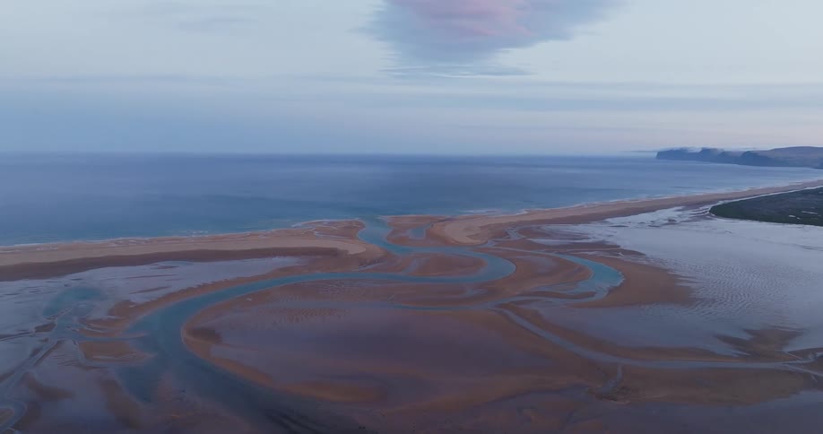 The shore is covered with wet sand