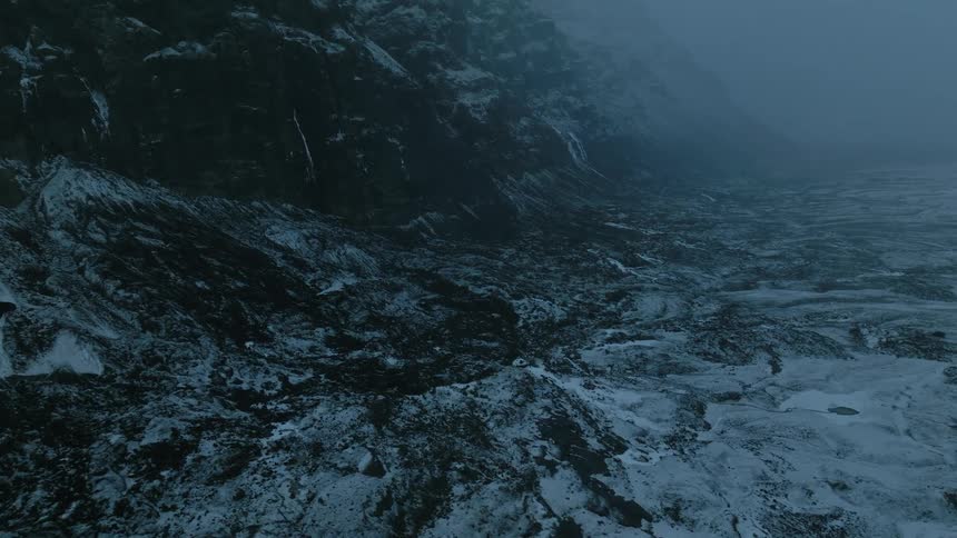 Ground panorama next to snowcovered mountains