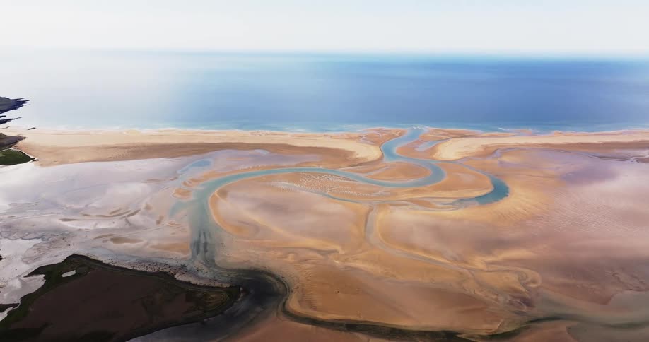Aerial panorama of sand mixed in the midst of the sea