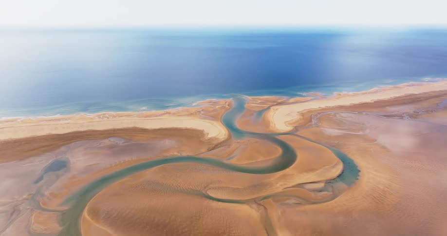Aerial of sand sheets on a paradisiacal beach