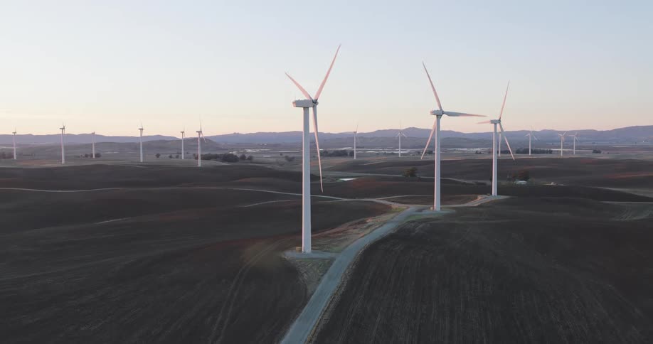 Aerial of a wind farm at sunset