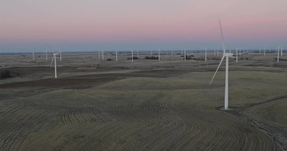 Wind turbines spin on a wind farm