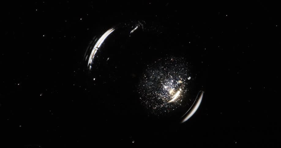 Closeup of a shiny and abstract liquid bubble