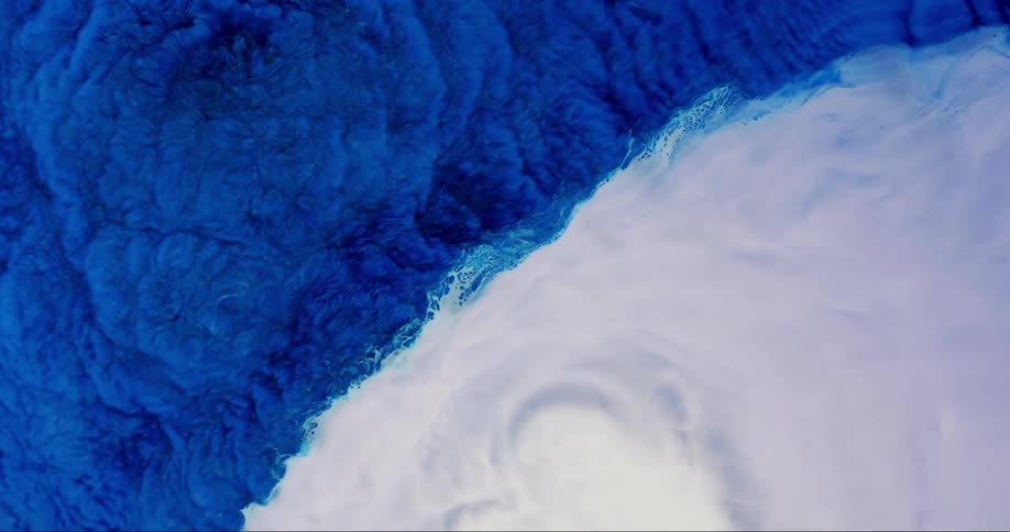 Blue and white fluid mixed in abstract motion